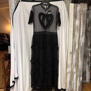 Black tulle dress with the heart detail and pom-poms